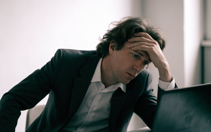 Man drained at his desk in the afternoon